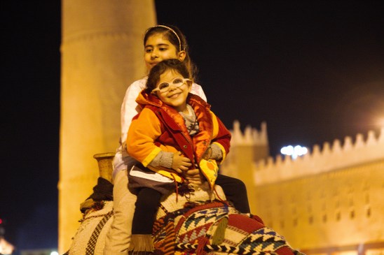 Children riding camels, Janadiriyah, Riyadh, 2014