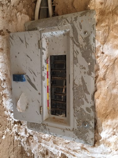 Electrical panel inside a mud brick ruin, Saudi Arabia